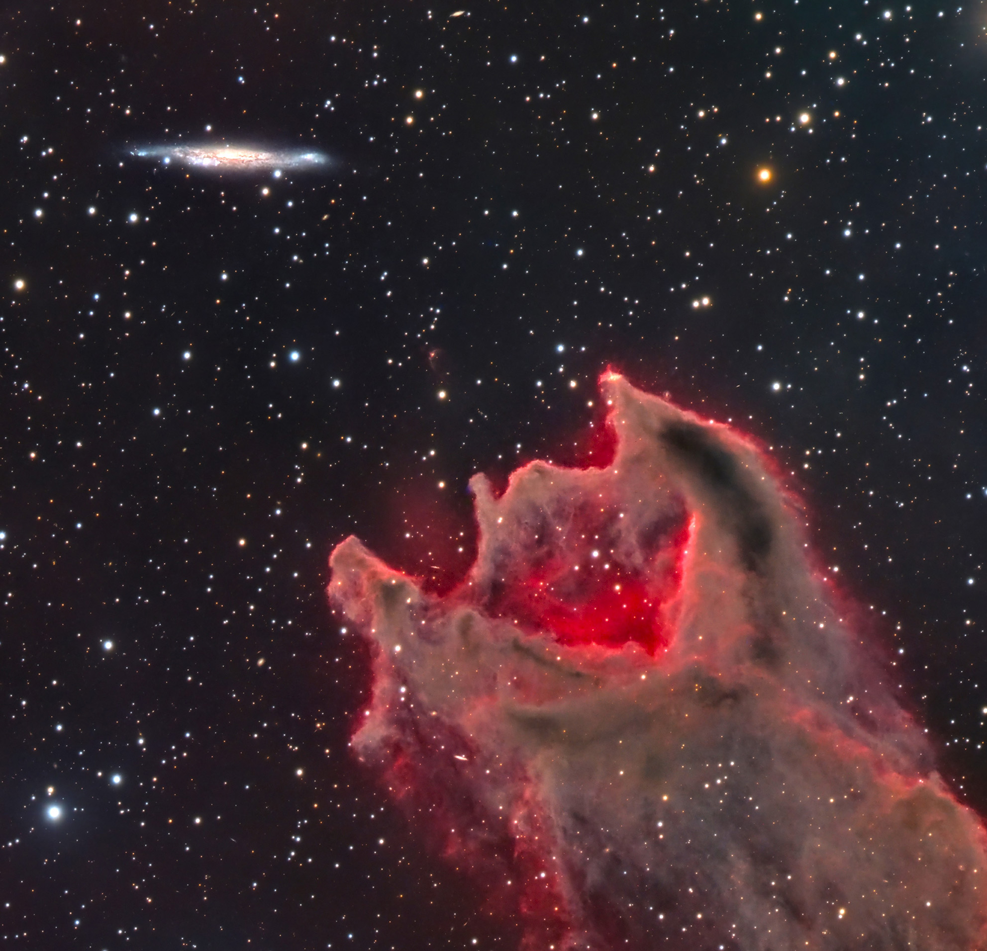 a cloud shaped like a giant worm with its mouth open against the background of a dark starry sky