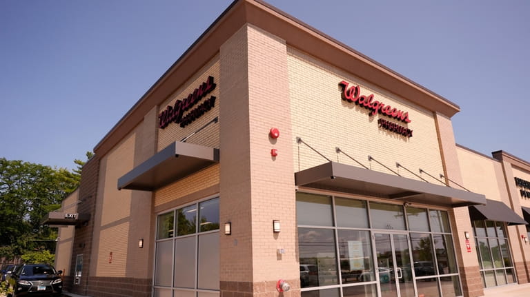 A Walgreens pharmacy store is seen in Deerfield, Ill., Thursday, ...