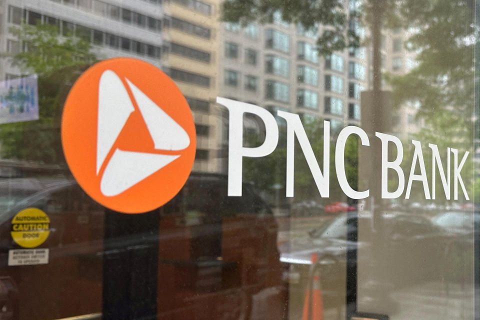 FILE PHOTO: The logo of PNC Bank, a subsidiary of PNC Financial Services Group, is seen in a branch window in Washington, US April 30, 2023. REUTERS/Ashraf Fahim/File Photo