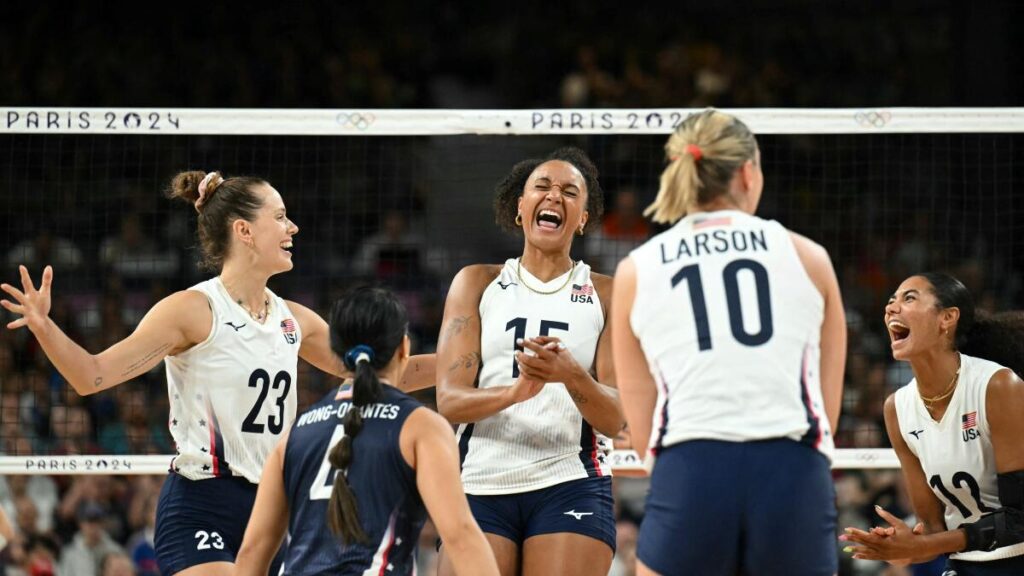 Volleyball players Kelsey Robinson, Justine Wong-Orantes, Haleigh Washington, Jordan Larson and Jordan Thompson celebrate.