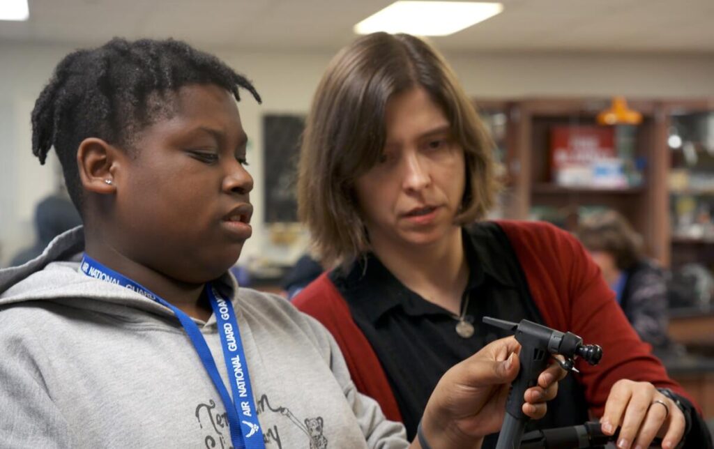 High school freshman DeWayne Murphy talks to Milks, his science teacher, about a class experiment.