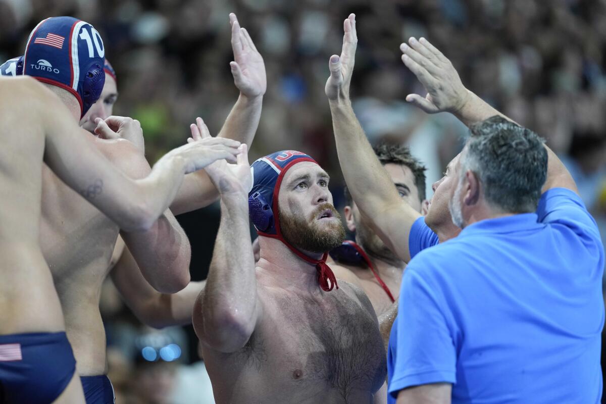 Alex Bowen of the US celebrates with his teammates after Monday's victory.