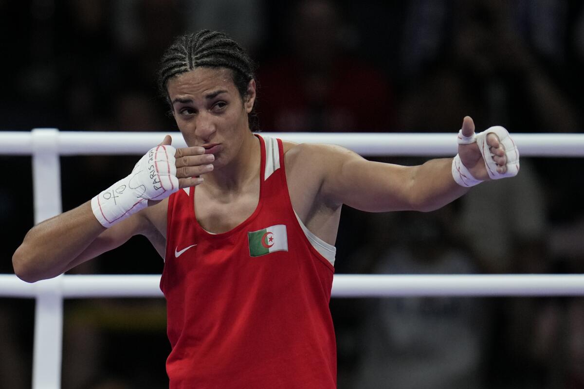 Algeria's Imane Khelif celebrates after winning his quarter-final match.