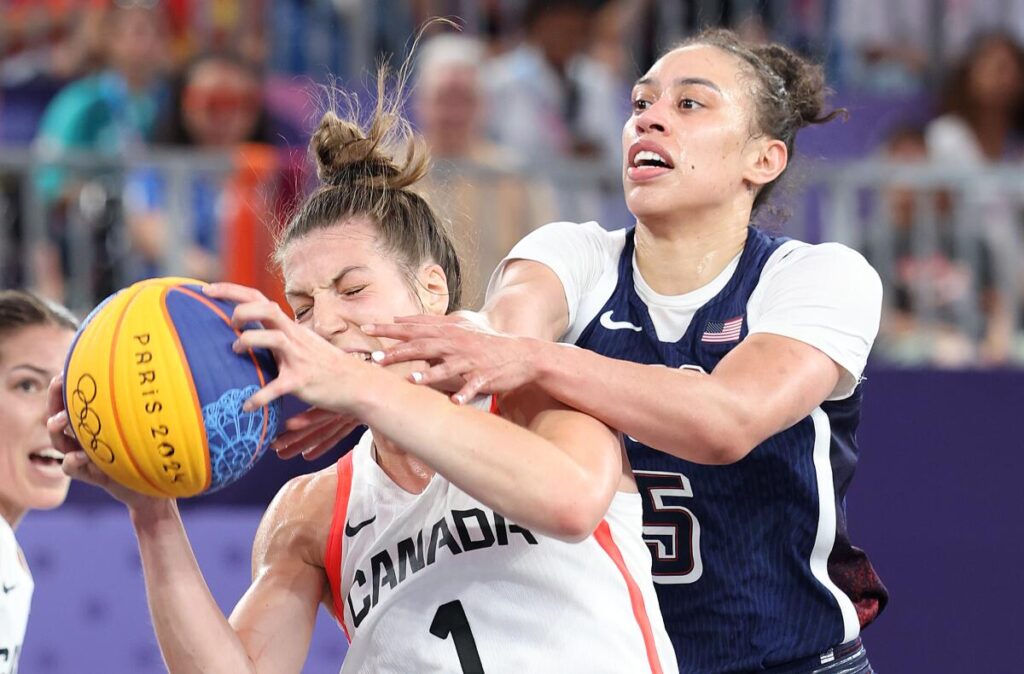 Dearica Hamby tries to steal the ball from Canada's Michelle Plouffe in the 3X3 basketball bronze medal match.