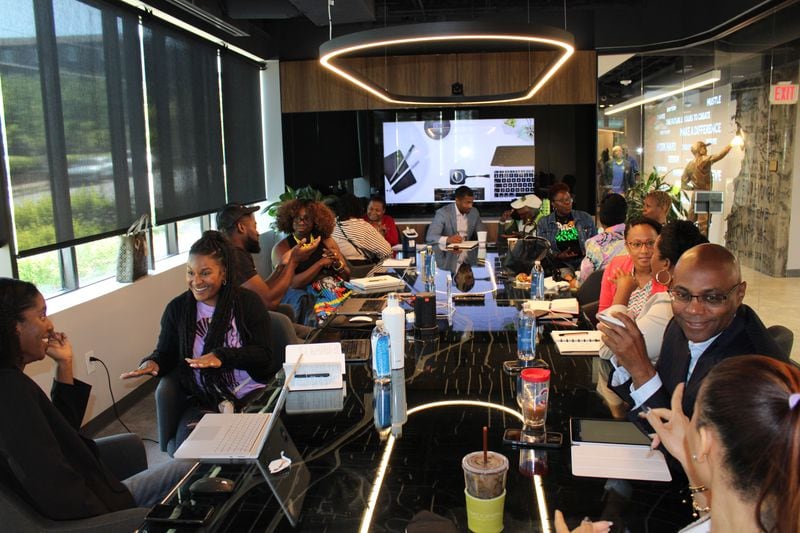 Black business owners gather at the Russell Innovation Center for Entrepreneurs to collaborate and share their experiences in the business industry.  The center offers training parties for small groups of people who want to support personal and professional development.  (Photo/Adrian Shelby)