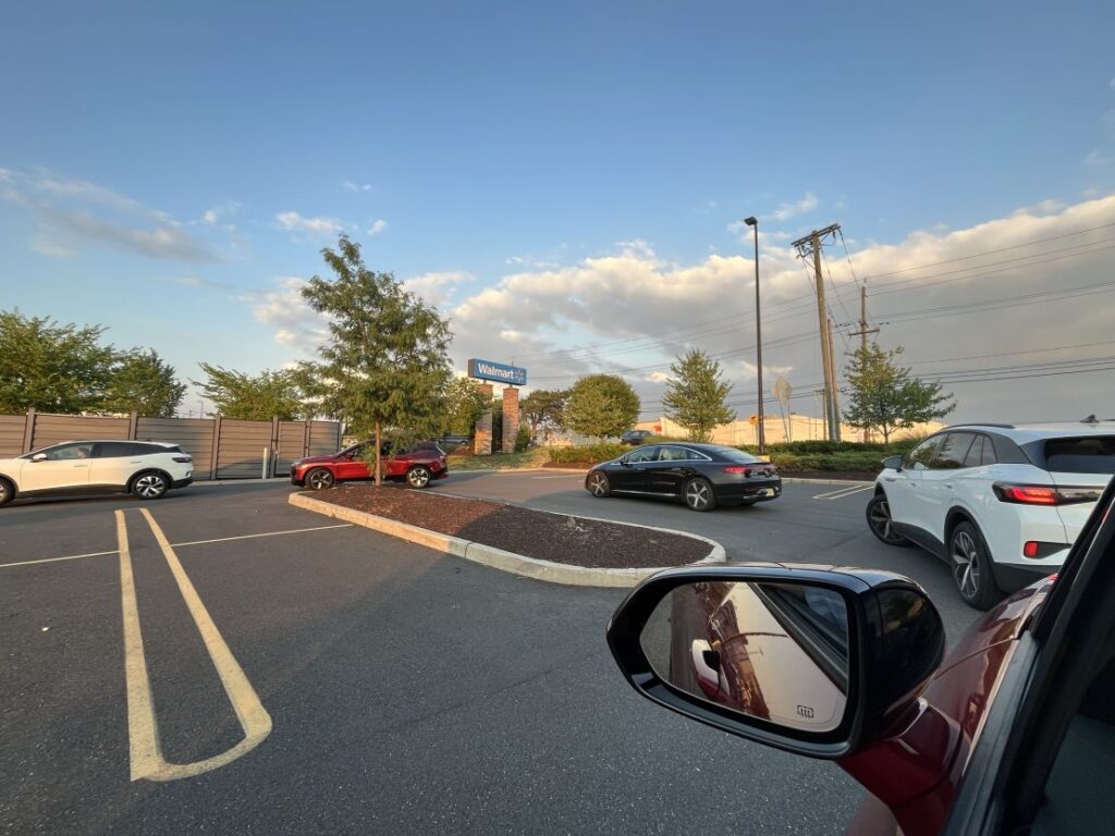 A line of EVs wait to charge at the Electrify America charging station in East Brunswick, New Jersey, on July 6.