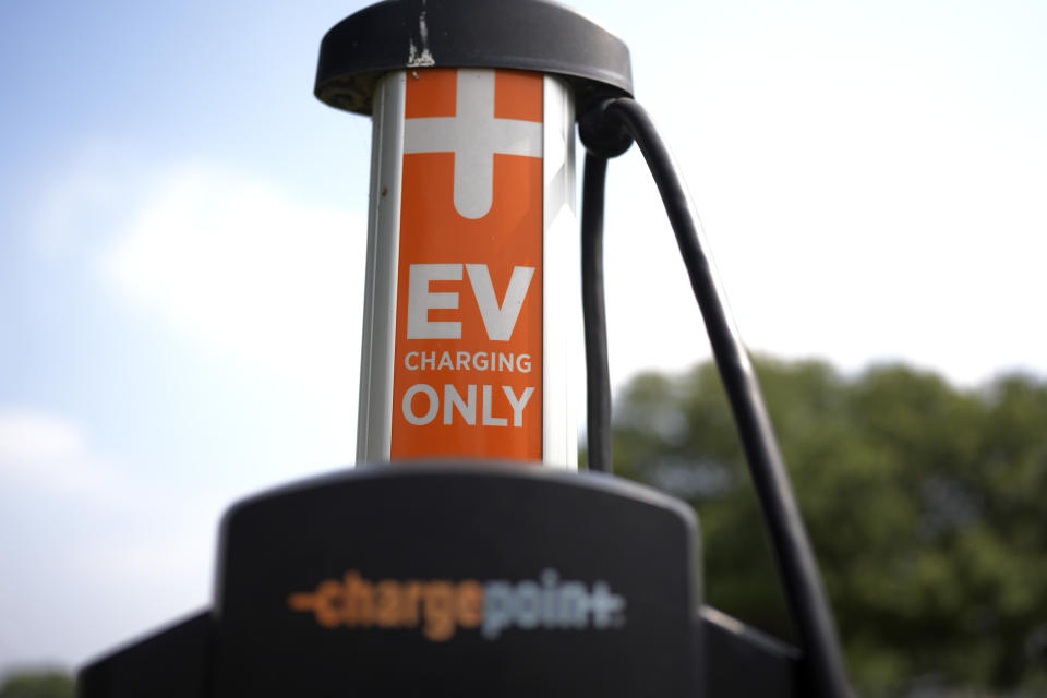 An EV charging station is seen Thursday, May 9, 2024, in San Antonio.  Many Americans are still not sold on buying electric for their next car purchase.  High prices and a lack of easily accessible charging stations are major sticking points.  (AP Photo/Eric Gay)