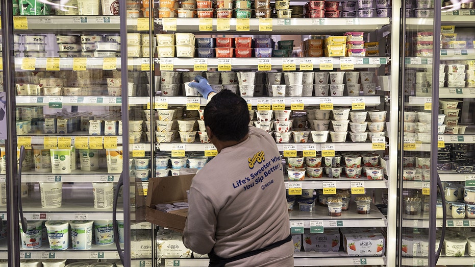 An employee stocks shelves in Washington, DC