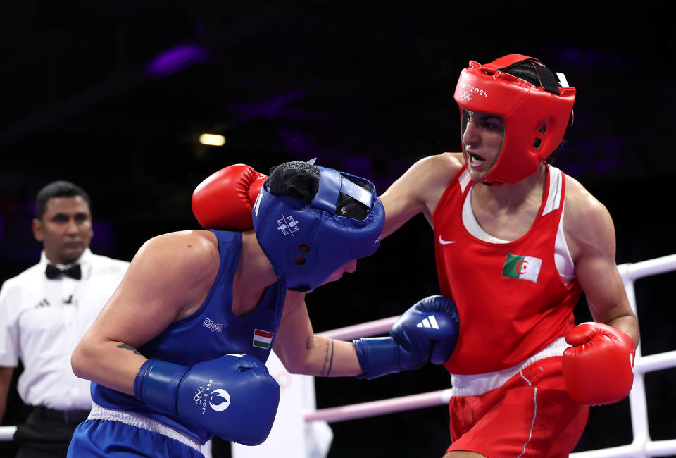 PARIS, FRANCE - AUGUST 03: Imane Khelif of Team Algeria and Anna Luca Hamori of Team Hungary exchange punches during the women's 66kg quarterfinal match on day eight of the Paris 2024 Olympic Games at the North Paris Arena on August 03, 2024 in Paris.  , France.  (Photo by Richard Pelham/Getty Images)