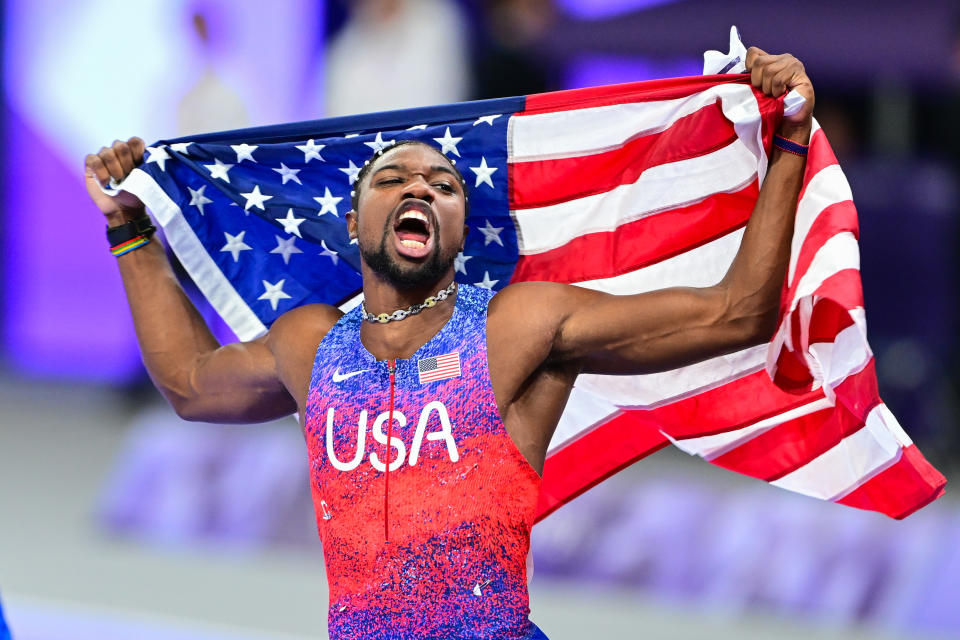 Noah Lyles of the USA celebrates after winning the men's 100m final at the Paris 2024 Olympic Games at the Stade de France in Saint-Denis, north of Paris, on August 4, 2024. (Photo by Mehmet Murat Onel/Anadolu via Getty Images )